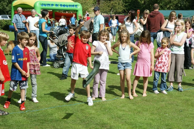 Children take part in a welly throwing contest at Sleights Show.