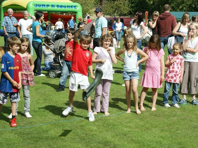 Children take part in a welly throwing contest at Sleights Show.