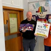 Martin Dowey hands over the selection boxes at Scarborough Hospital’s Rainbow Ward