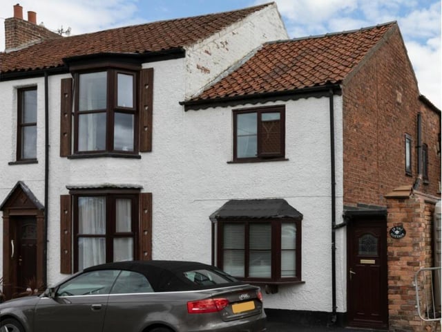 A front view of the four-bedroom, semi-detached property.