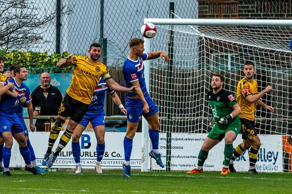 Whitby Town's Connor Simpson heads the ball clear during a 2-1 home win against Prescot Cables. Photos by Brian Murfield