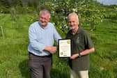Eddie Knorn of Scarborough CAMRA presents the certificate to Mark Hayes of White Lodge Farm