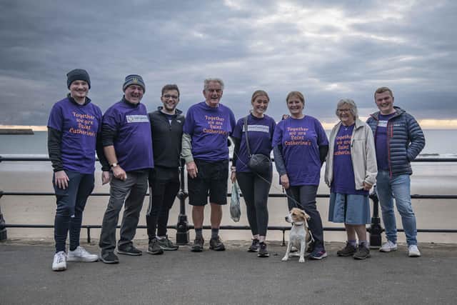 Sunset walkers in Scarborough.