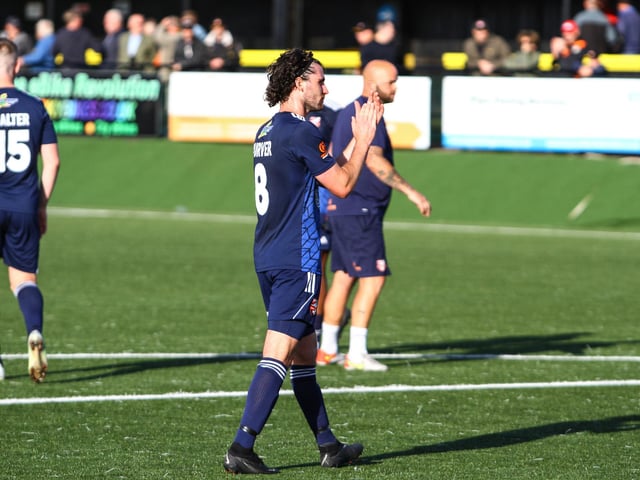 The Scarborough Athletic FC players applaud the fans who made the long trip to Rushall.