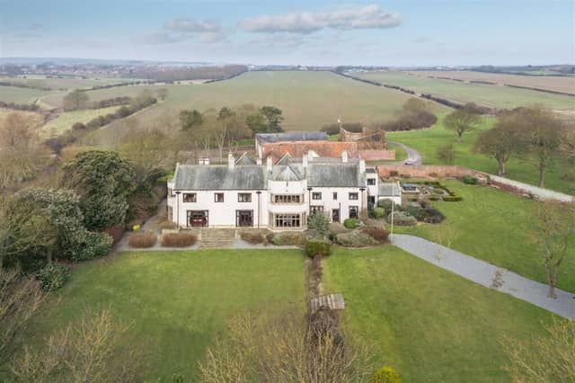 An overview of the majestic property and its open surroundings.