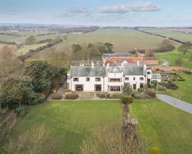 An overview of the majestic property and its open surroundings.