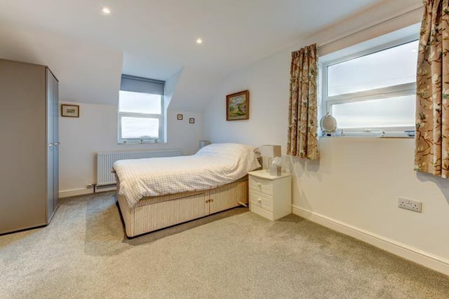 One of the property's double bedrooms, with sea views.