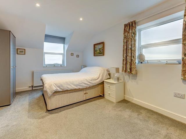 One of the property's double bedrooms, with sea views.