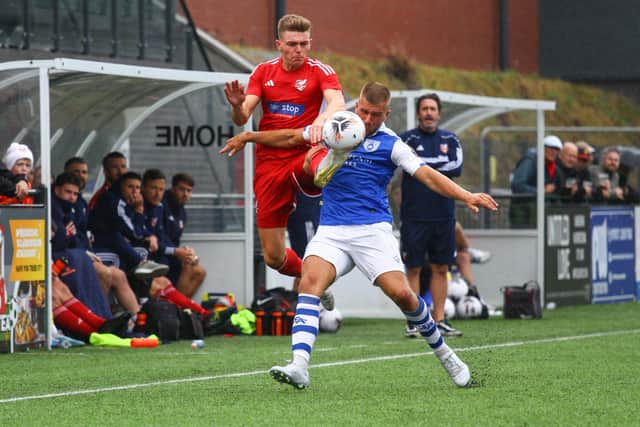 Boro striker Jake Charles challenges an Angels player.