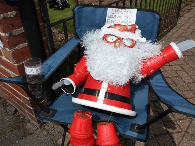 Santa enjoys a beer and the sunshine