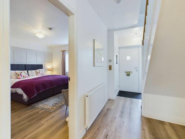 The ground floor double bedroom the hallwis entered from the hallway