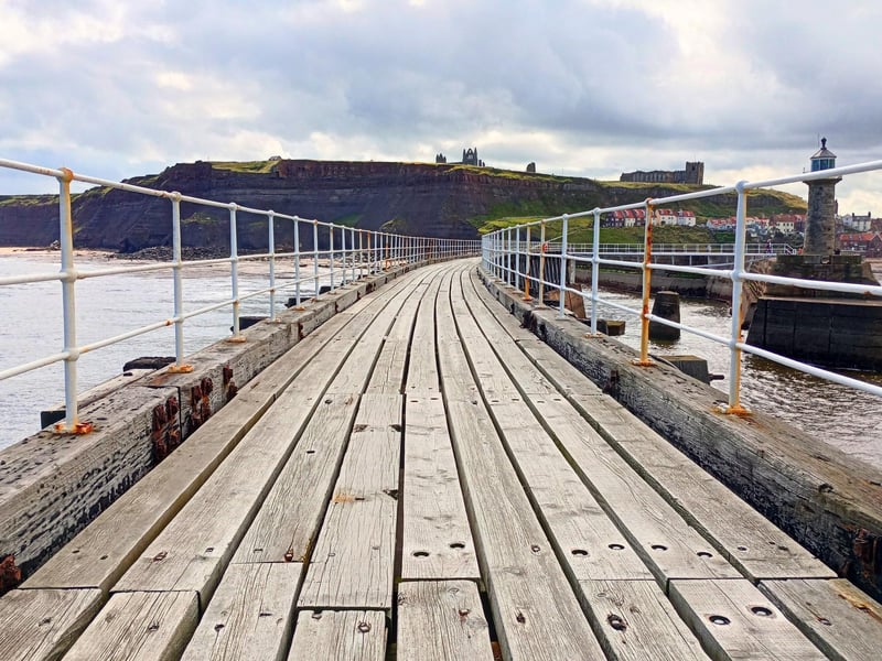 View of Whitby Abbey Headland from the east pier, by Andy Hill.