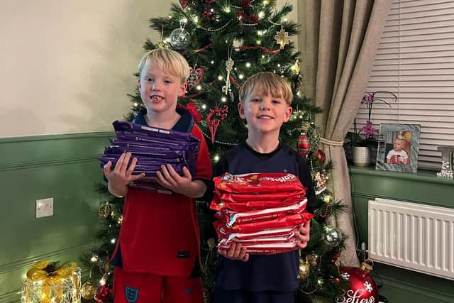 Finlay, 6, and Ellis, 4 sold their old toys to raise money to buy chocolate for the Rainbow Centre