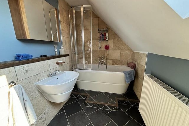 This modern en suite facility is one of three in the property.