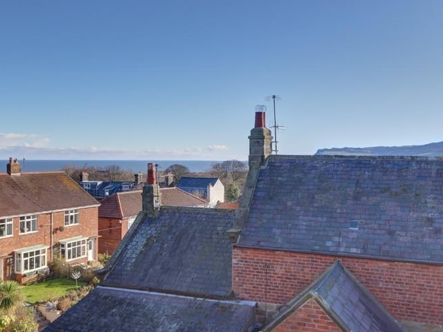 A view from the house, over rooftops to the sea.