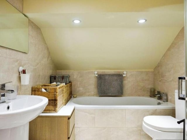 A modern bathroom with super size bath.