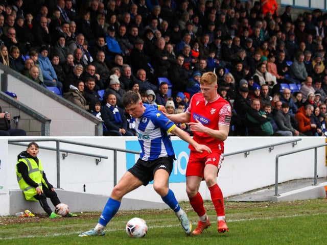 Boro's Alex Wiles tracks a home player.