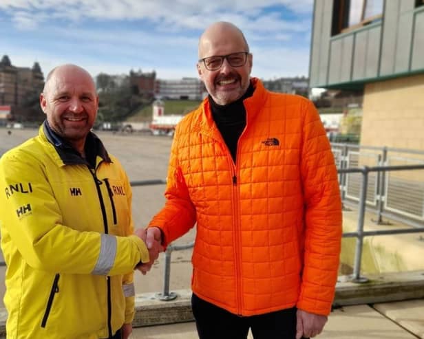 Michael Whitely and Scarborough RNLI Coxswain, Lee Marton, who was part of the RNLI crew on the day Michael was rescued. picture: RNLI/Clare Hopps