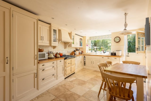 A farmhouse style kitchen with a range of integrated appliances.