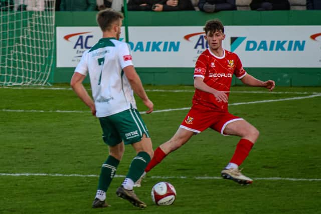 Goalscorer Josh Dunnett on the attack for Ferriby against Brid's loan defender Leon Gibson-Booth. Photo by Ewan Cameron.