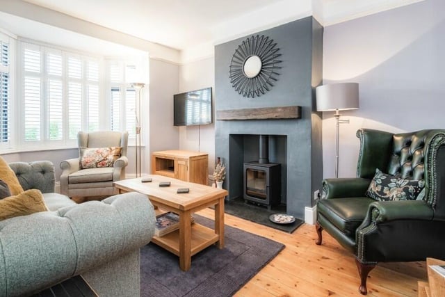 The sitting room has a stove set in to the chimney breast as a central feature.