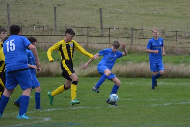Scalby Under-14s (yellow kit) and Heslerton do battle