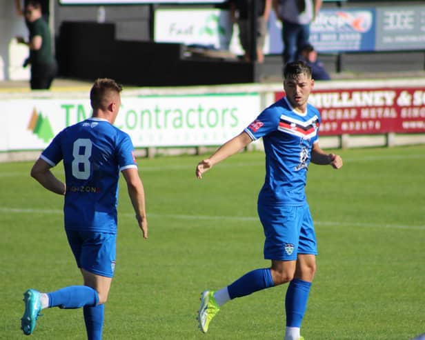 Stephen Walker, right, celebrates one of his goals with Aaron Haswell. PHOTOS BY OWEN COX