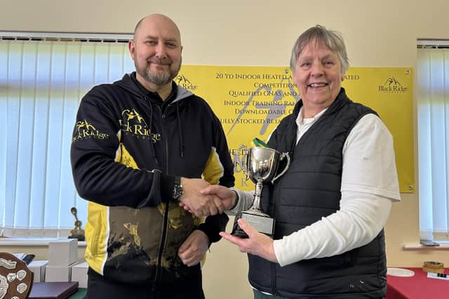 Lady Longbow Champion Helen Falkingham collects her trophy.