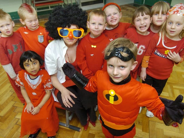 Red Nose Day at Friarage School: James Roach (front) dresses in red with (back, from left).. Ryan Taylor, Sumaya Half, Jack Thompson, teacher Cheryl Cappleman, Courtney Williamson, Sam Jackson, Emma Bagley, Lucy Bell, and Kira Mitchell. 071191a
