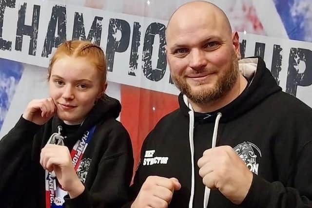 Teenager Sarah Dicks, right, shows off her medals at the WKO British Championships with proud dad and Typhon Head Coach Pete.
