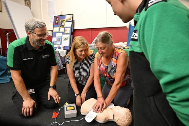 Janette Wilkinson and Elaine Matson working on the first aid drills in the church hall