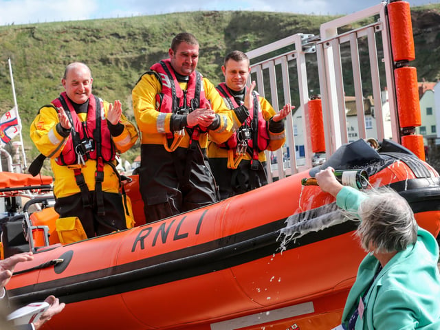 Staithes abnd Runswick Lifeboat Weekend is on from August 18 to 19. Here, Susan Tongue pours champagne over the boat at the naming ceremony and service of dedication for the B class lifeboat Sheila and Dennis Tongue III.
