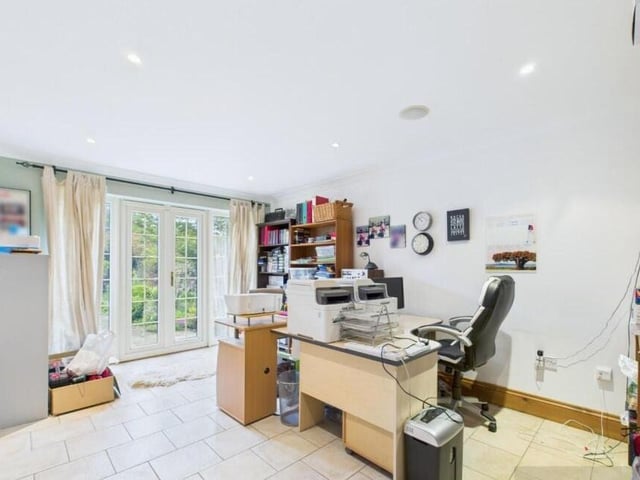 A second, flexible reception room is currently used as a home office.