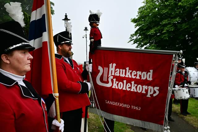 The Norwegian flag and banner bearers from Haukerød Skolekorps