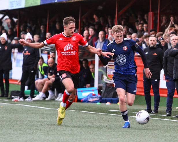 Scarborough Athletic's Harry Green tries to hold off a Tamworth player. PHOTOS BY ZACH FORSTER