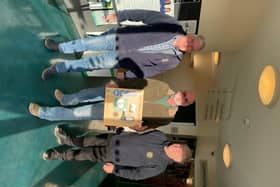 Whitby Lions Bob Stevens, Bob Bennett and Chris Roe with the new defibrillator at The Green Lane Centre, Whitby.