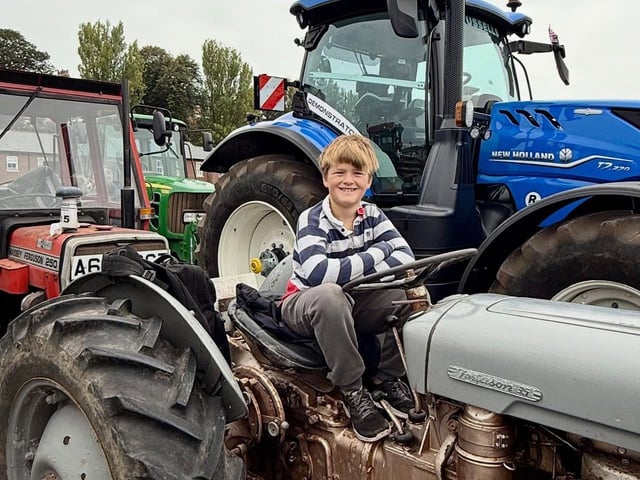 All smiles for this youngster at the wheel!