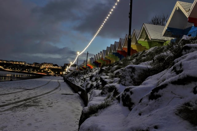Twinkling lights and colourful chalets.