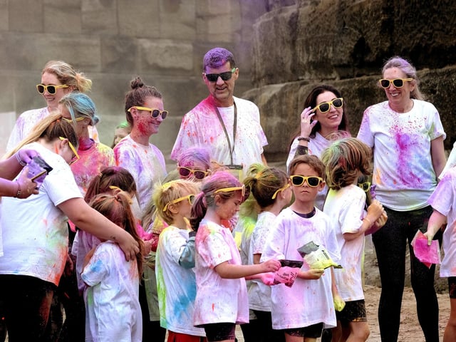 All smiles - and lots of colour - on Whitby's West Cliff Beach.