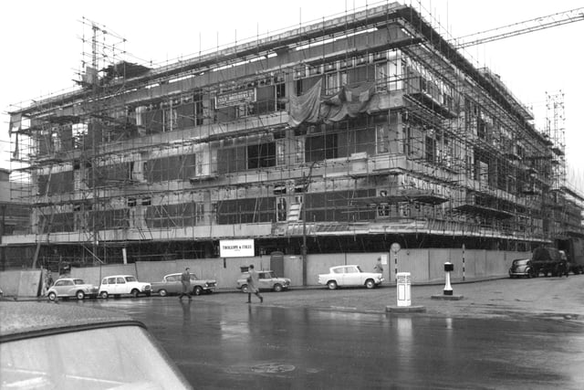 The new Cole Brothers building is seen under construction in 1963.