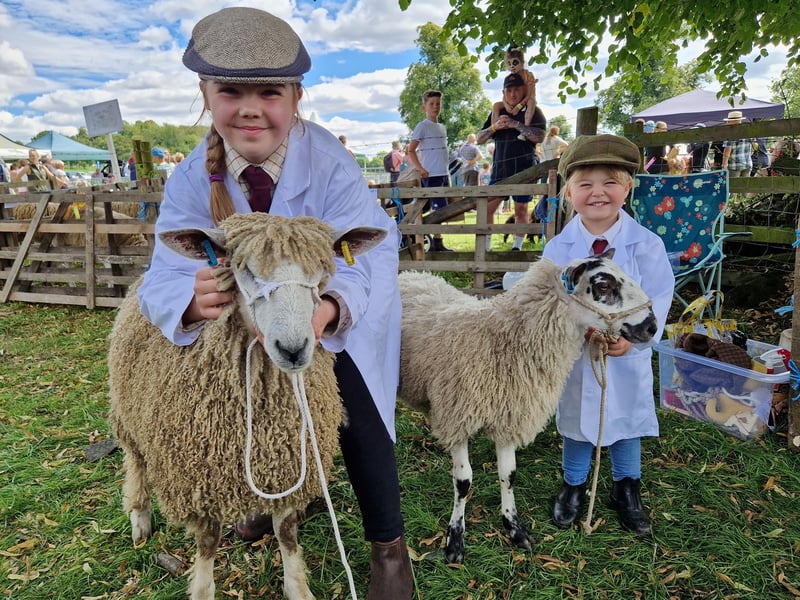 Daisy Lazenby, 10, and Polly Lazenby, 3, from the Howe Hills Flock with their Leicester Longwool sheep