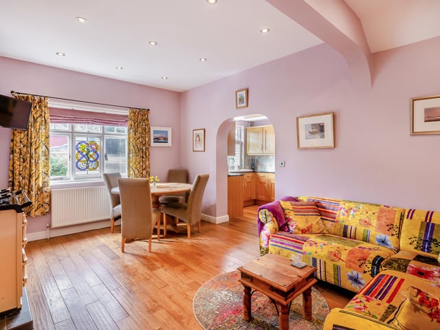 The bright breakfast room has plenty of gfloor space, together with an Aga.