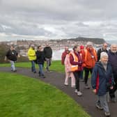 Carers Plus Yorkshire community engagement advisor Sarah Cockburn (front right) with Stuart Wilson, Paul Connor and fellow Stepping Out members on a respite walk in Scarborough.