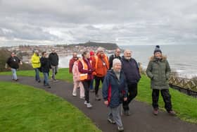 Carers Plus Yorkshire community engagement advisor Sarah Cockburn (front right) with Stuart Wilson, Paul Connor and fellow Stepping Out members on a respite walk in Scarborough.