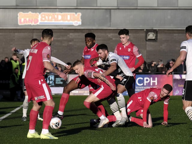 Danny Greenfield, who is on loan from Spennymoor at Boro, shields the ball from Darlington's Ben Hedley