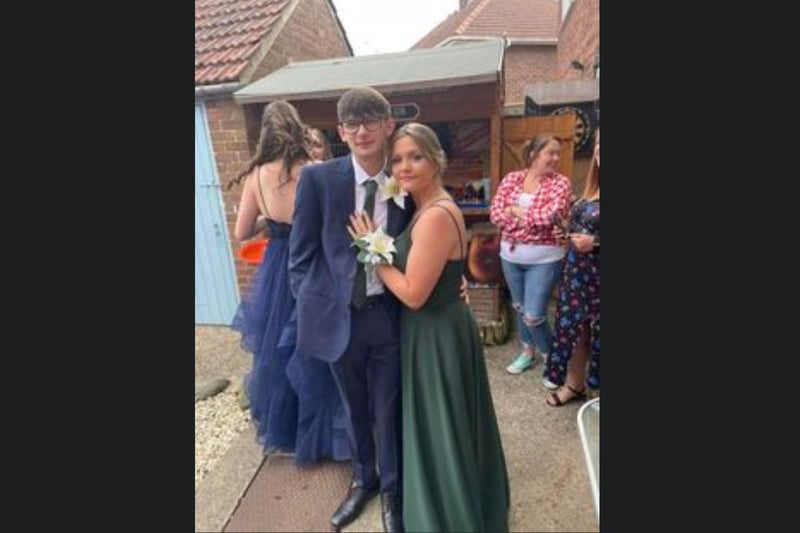 This couple are looking stunning with their matching corsages.