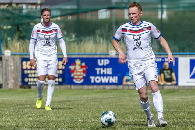 Midfielder Michael Woods on the ball for Whitby. Photo by Brian Murfield