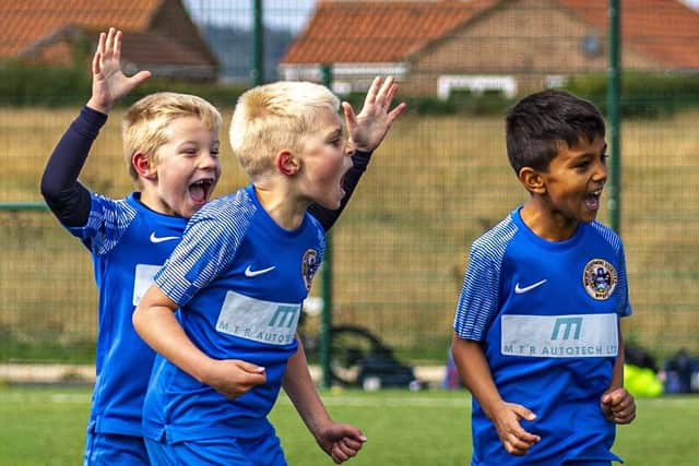 The home team celebrate a goal during the match against Grangetown Boys. Photo by Brian Murfield