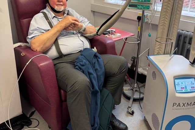 A patient with one of the new scalp coolers.