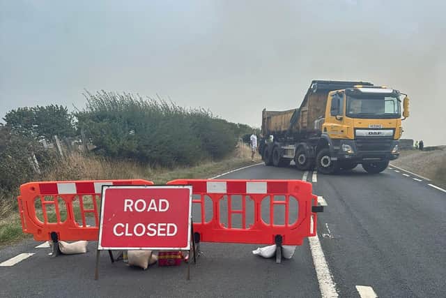 Road closures are in place due to smoke billowing across the road